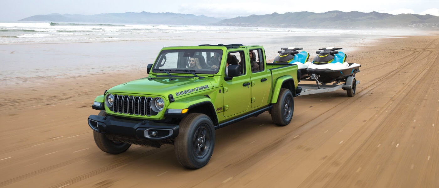 2026 Jeep Gladiator Exterior Driving On Beach With Jetskis