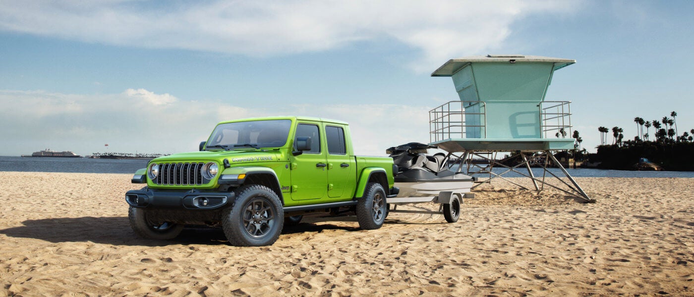 2026 Jeep Gladiator Exterior Parked Near Back Guard Stand With Jetskis